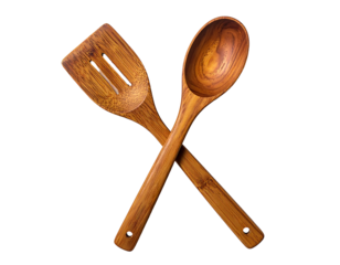 Two crossed wooden cooking utensils, a spatula and spoon, on a black background