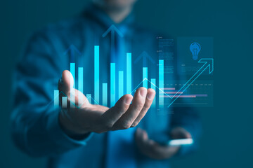 Businessman showing data analytics and financial growth graph for success strategy