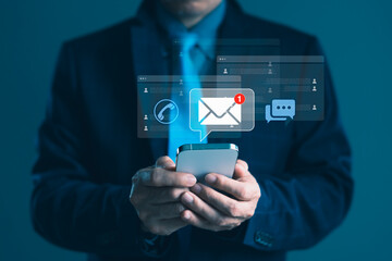 Businessman using smartphone with email notification icon for digital communication, online messaging, and marketing technology concept background