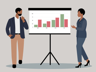 Two business people, man and woman, standing next to a flip chart displaying a bar graph with business trends