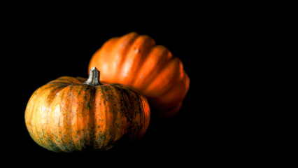 Pumpkins and other decorative items for Halloween and Day of the Dead festivities with red and orange LED lights
