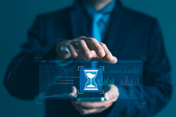 Businessman managing time and schedule with virtual hourglass and calendar interface for digital productivity, business planning, and performance monitoring