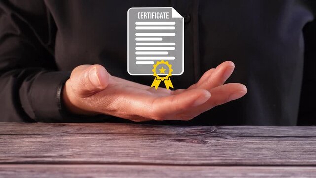 Close-up of a business person's hand at a table holding an animation of a document with a certificate