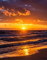 Naklejka premium Golden sunset over the ocean