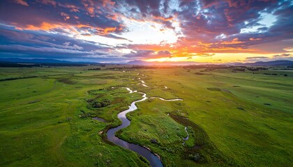Vibrant Sunset Ignites the Sky Above a Serpentine River Valley