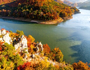 Autumnal view of a winding river with colorful forests and rocky outcrops