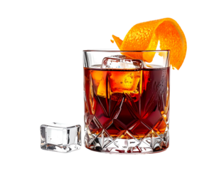 Dark amber cocktail in a cut-glass tumbler, garnished with orange peel and ice cubes