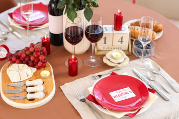 Table setting for Valentine's Day with greeting card, closeup