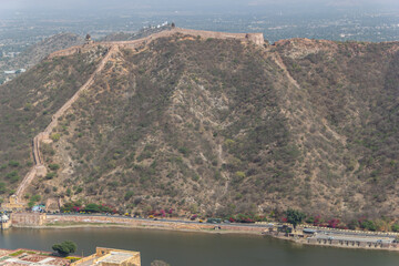 Fortification Wall Ascending Steep Hillside above a Lake in Rajasthan