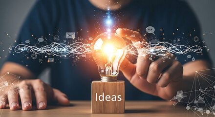 Person holding a glowing lightbulb symbolizing innovative ideas, connected to a network of digital information.
