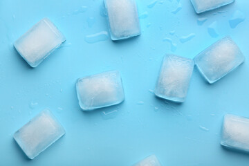 Many frozen ice cubes on blue background