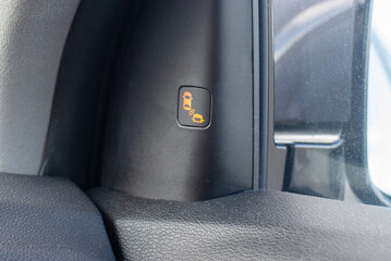 Car blind spot monitoring system indicator light on side mirror.