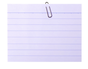 Blank lined notepad paper with metal clip