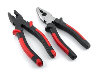 Fototapeta premium Two pairs of pliers, black and red handles, on a white background