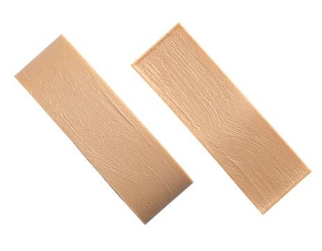 Two light beige rectangular blocks, angled, appear like building material or a decorative element