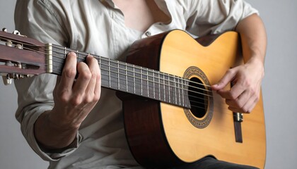 Obraz premium A man plays a classical guitar