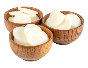 Three shallow wooden bowls filled with round slices of a white root vegetable