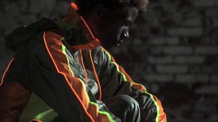 Man wearing reflective clothing in dark setting. - Powered by Adobe