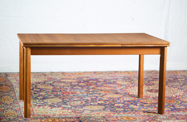 Restored Teak Draw Leaf Dining Table on Persian Rug

