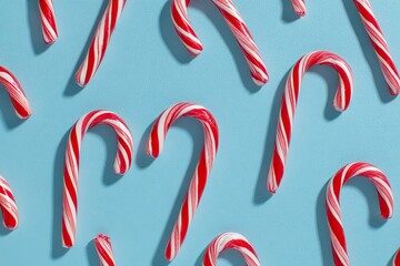 Candy canes arranged on a light blue background