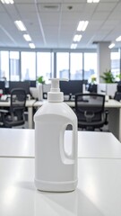 White plastic bottle of sanitizer on office desk, blurred background