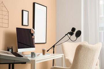 Interior of recording studio with workplace, microphone and synthesizer