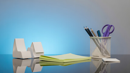 Desk setup with stationery, including pencils, scissors, notepad, and paperweights on a reflective surface against a blue gradient background