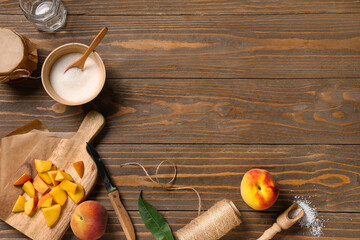 Composition with fresh peaches, jars and sugar for preparing tasty jam on wooden background