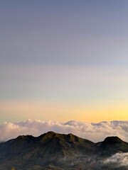 Mountain landscape with sunrise sky and clouds