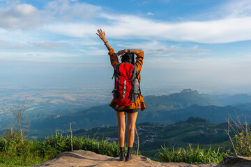 Hiker woman feeling victorious facing  on the mountain and celebrate success together on mt summit