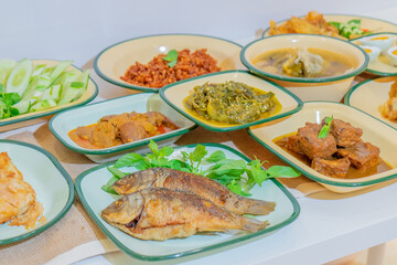 fried fish with lemon and salad