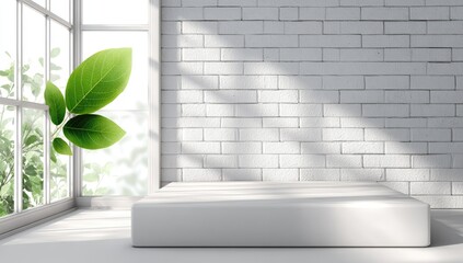 Empty white pedestal in a sunlit room with large windows and greenery