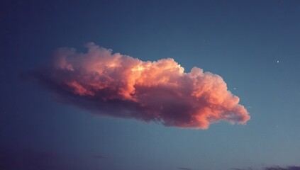 Naklejka premium Pink sunset cloud in a dark blue sky