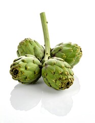 Obraz premium Fresh artichokes, light green, clustered on stem, isolated white background, studio shot, close-up, reflecting light