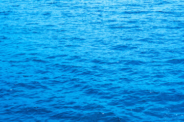 Top view beach sand background for summer vacation concept. Beach nature and summer seawater with sunlight light sandy beach Sparkling sea water 