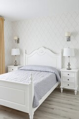 Modern bedroom design featuring elegant white furniture cozy atmosphere bright natural light minimalist style
