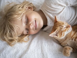 A serene moment of a child peacefully sleeping alongside a relaxed orange tabby cat on a soft white blanket.
