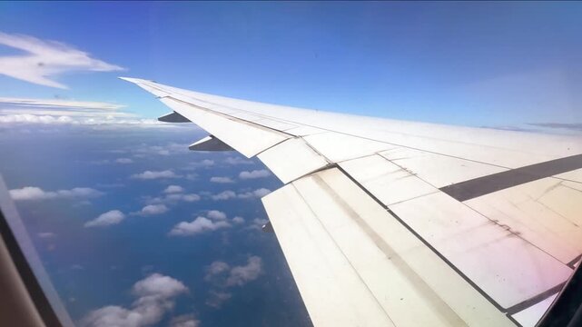 Emirates flight from Dubai to Seychelles, footage of wing and clouds under 24fps 006