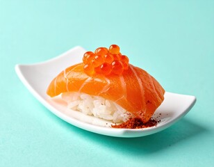 A close-up of salmon nigiri with bright orange roe on white rice, served on a glossy white dish against a solid light blue background