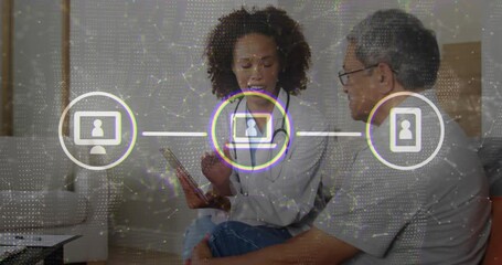 Female doctor tapping tablet educating patient network icons linking monitor laptop smartphone