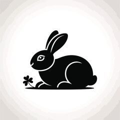 Obraz premium Black rabbit silhouette with clover bunny shamrock