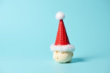 Christmas ice cream cone santa hat holiday dessert festive sweet treat christmas food photography blue background
