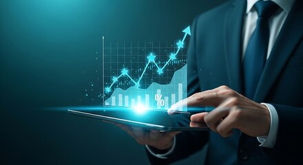 Businessman in a suit analyzing a glowing futuristic holographic financial stock market graph and data on a tablet computer screen with a dark background and blue light effects