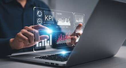 A person s hand interacts with a futuristic holographic interface displaying financial charts and data analytics projected above a laptop representing digital transformation and business intelligence