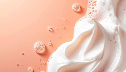 Creamy, foamy skin product on peach background