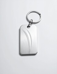 Fototapeta premium Brushed steel keychain with an elegant engraved design