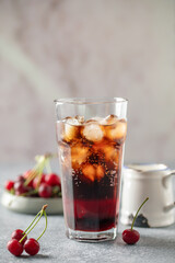 Cherry cola dirty soda in glass. Trending summer drink