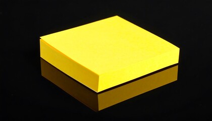 Yellow sticky note on black surface
