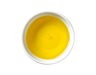 Yellow liquid in a small white bowl