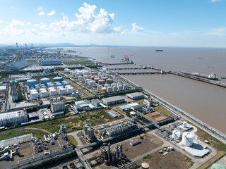 Aerial views of industrial areas with numerous large storage tanks